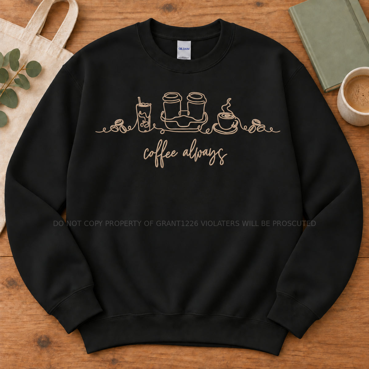 Black Coffee Always embroidered Gildan Softstyle sweatshirt arranged completely flat with cream thread