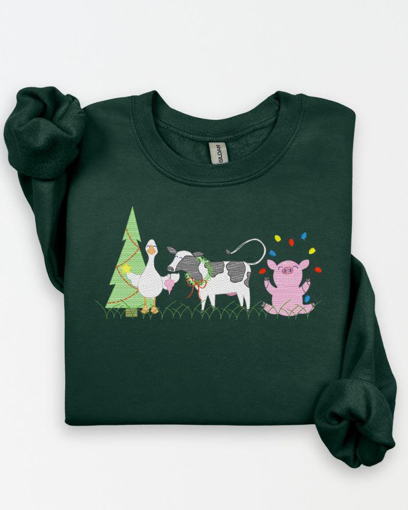 Green Gildan sweatshirt featuring festive farm animal Christmas embroidery.