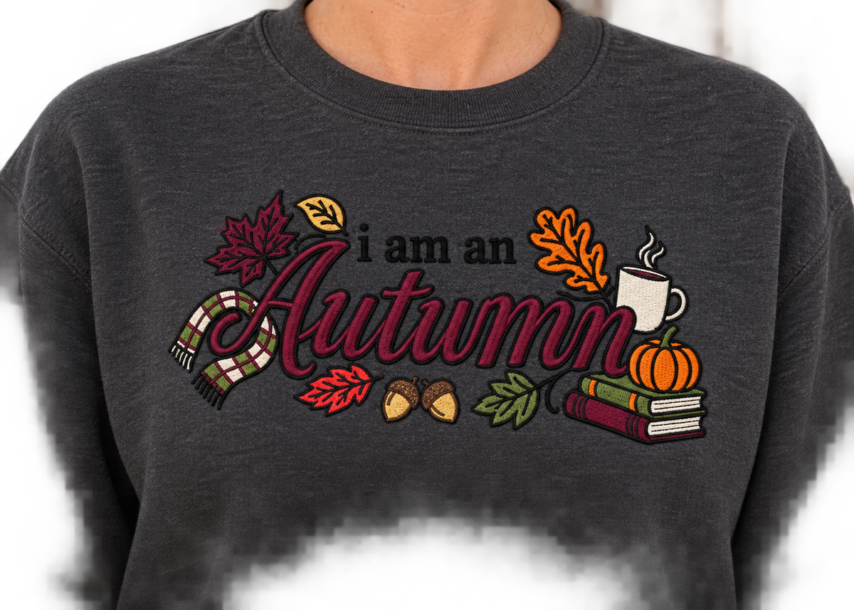 Close-up of I Am an Autumn multicolor embroidery thread detail on a crewneck sweatshirt