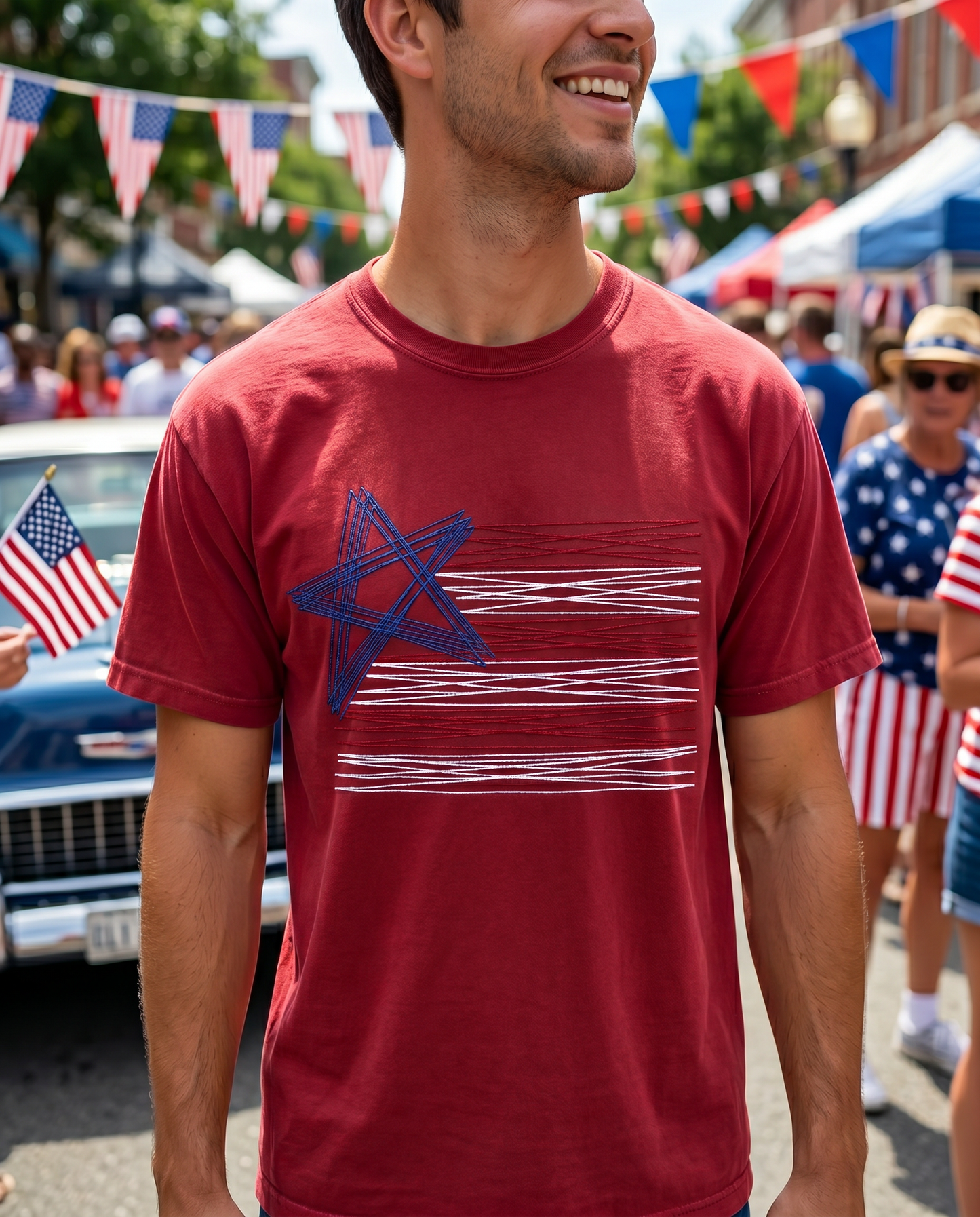 Man wearing red embroidered American flag shirt at Fourth of July street festival
