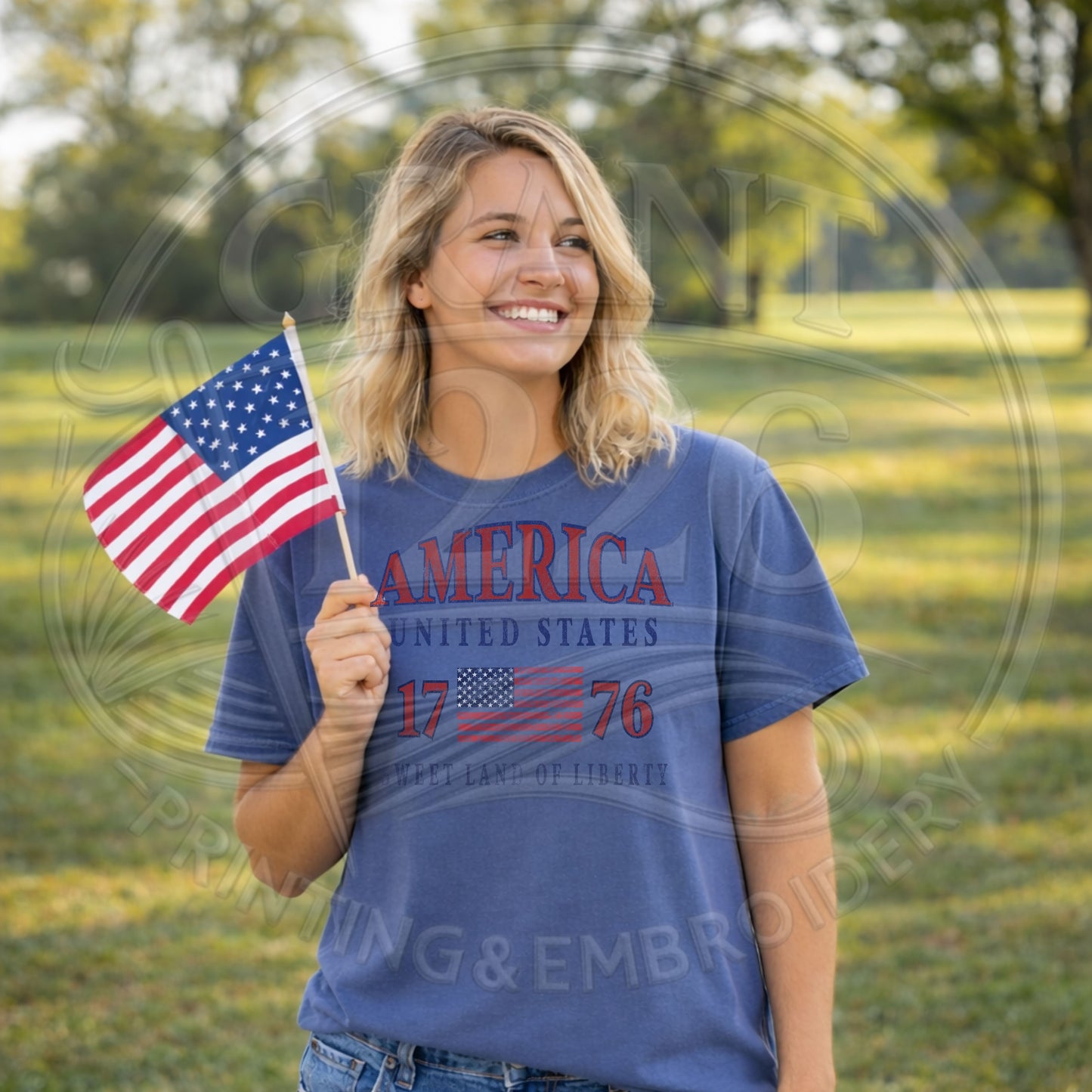 Woman wearing patriotic America 1776 shirt outdoors holding American flag