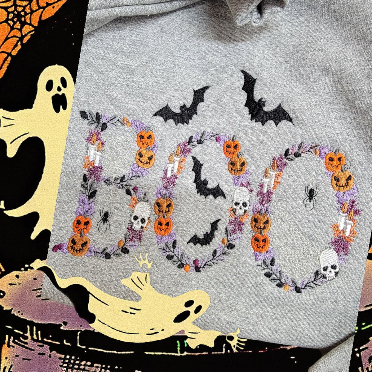 Close-up of Botanical BOO embroidery with pumpkins, skulls, candles, bats and florals on an Ash sweatshirt
