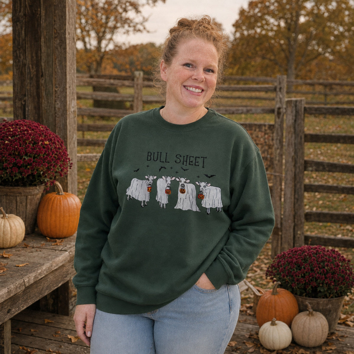 Samantha wearing Forest Green Bull Sheet cow ghost embroidered Halloween sweatshirt