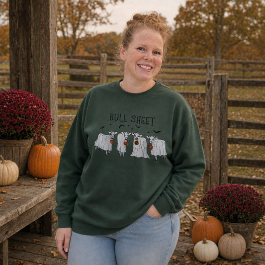 Samantha wearing Forest Green Bull Sheet cow ghost embroidered Halloween sweatshirt