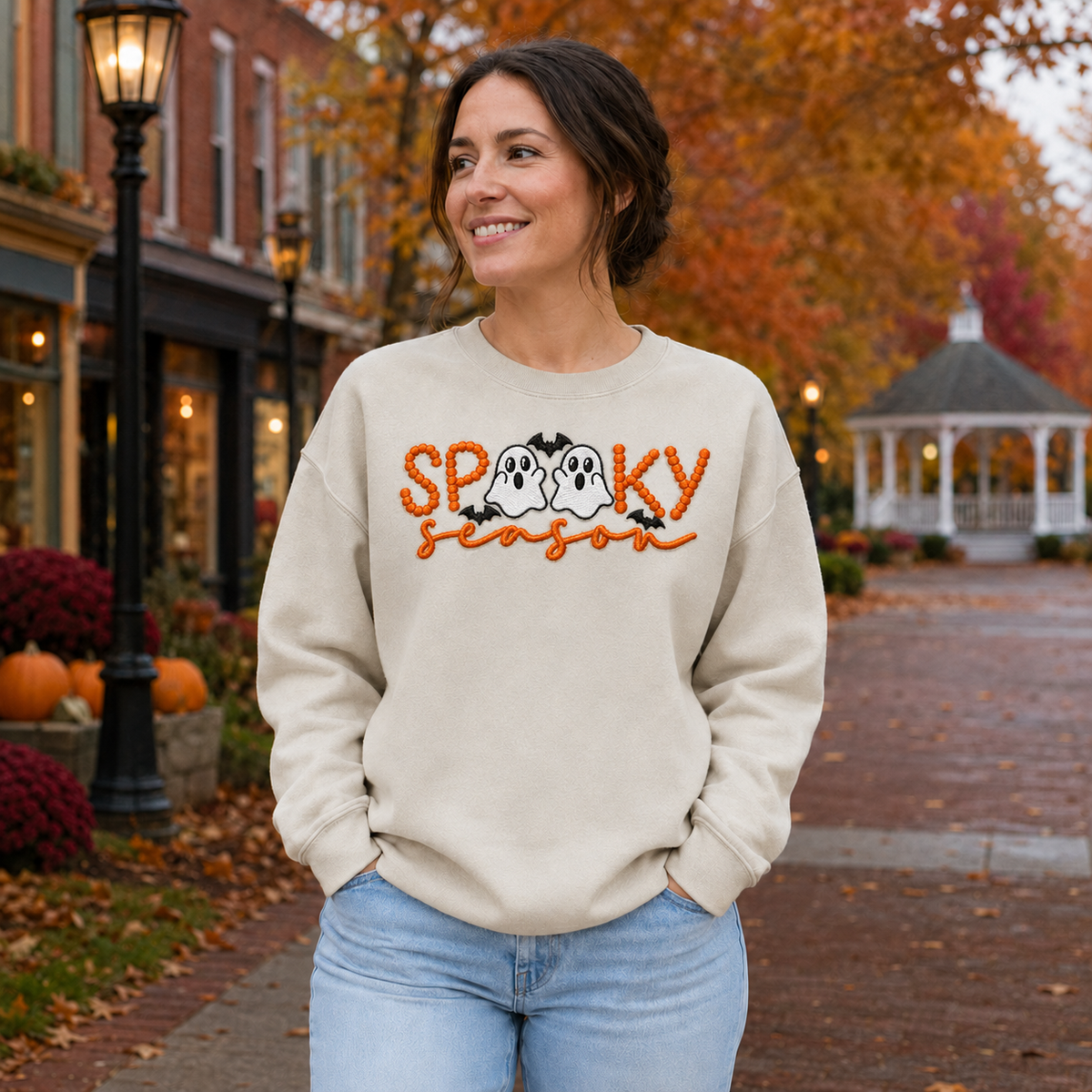 Adult sand Spooky Season embroidered sweatshirt with two white ghosts, orange lettering and black bats