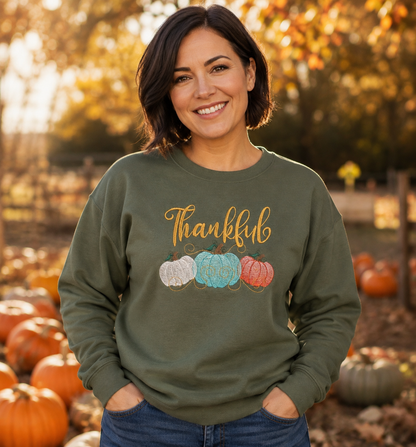Thankful pumpkin embroidered Gildan Softstyle sweatshirt in Military Green at a fall pumpkin patch
