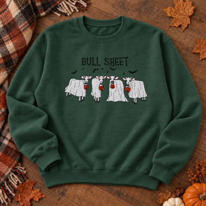 Forest Green Bull Sheet cow ghost embroidered Halloween sweatshirt shown completely flat in an autumn flat lay