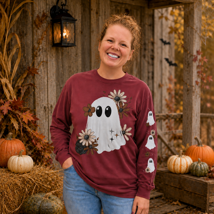 Woman wearing a Crimson Comfort Colors 6014 floral ghost Halloween long-sleeve shirt with sleeve design