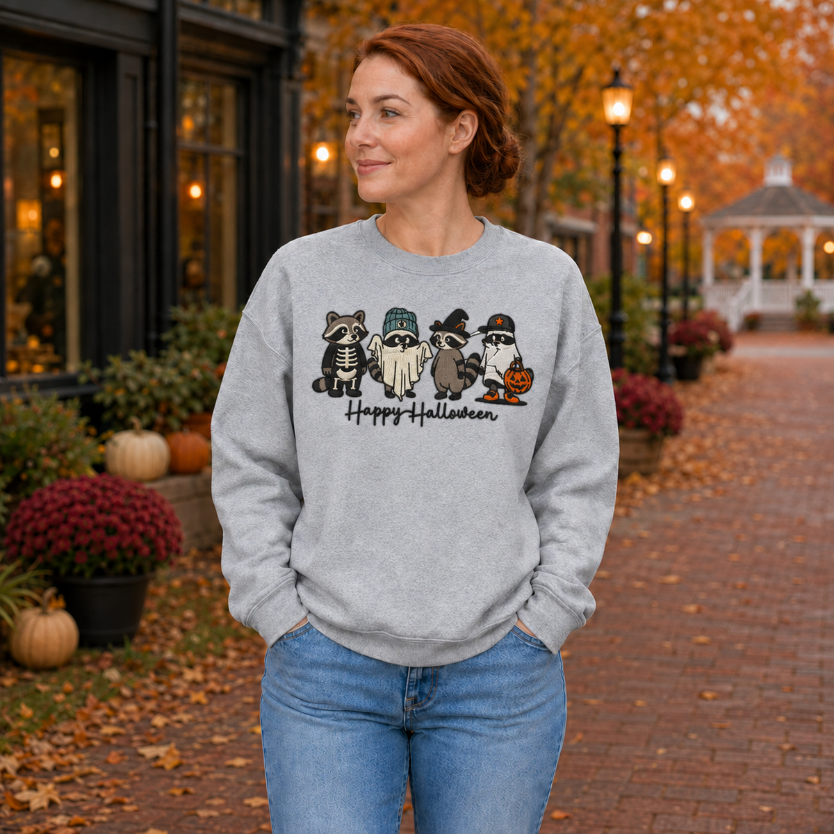 Woman wearing Sport Grey Happy Halloween embroidered raccoon crewneck sweatshirt