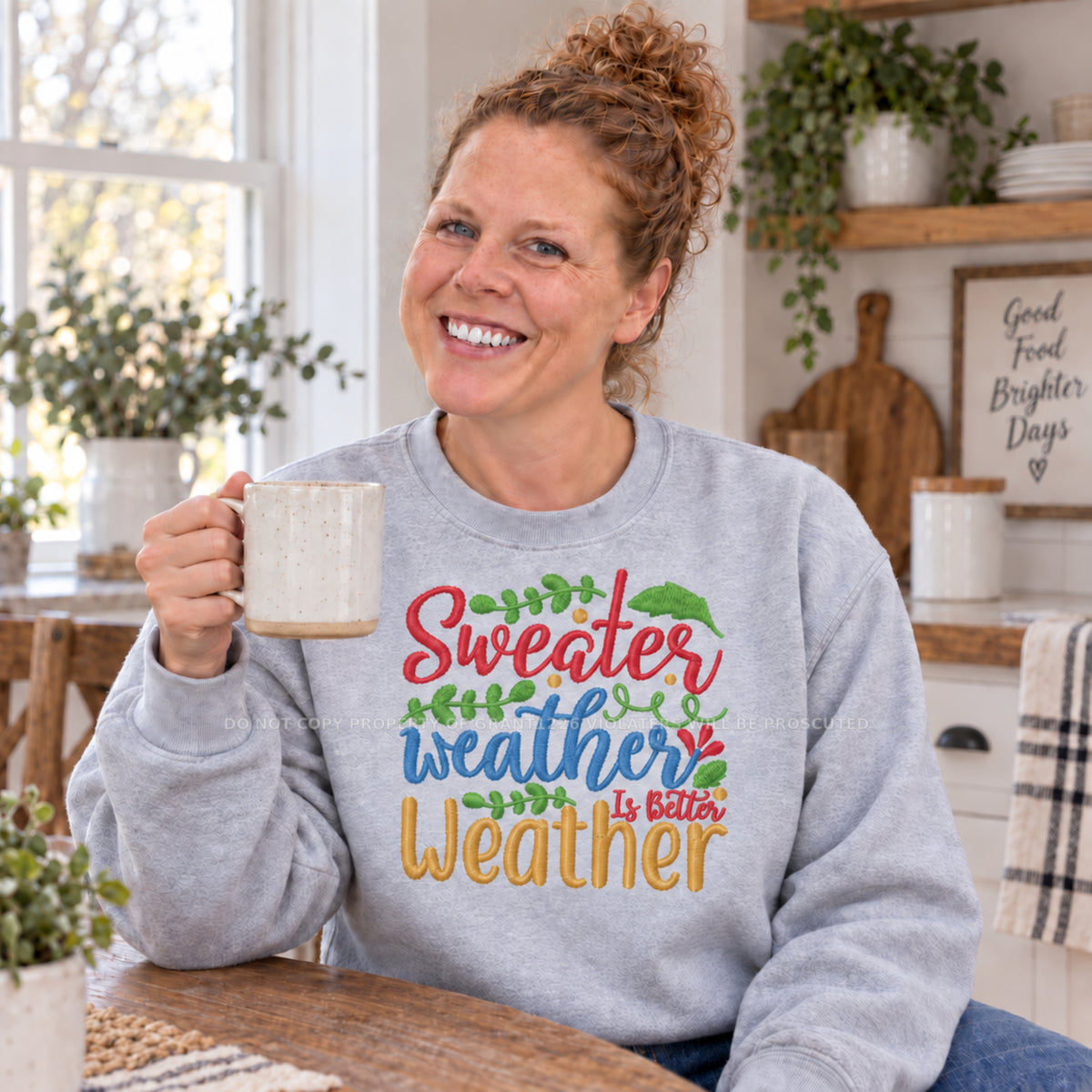 Ash Sweater Weather Is Better Weather embroidered sweatshirt modeled with a coffee mug