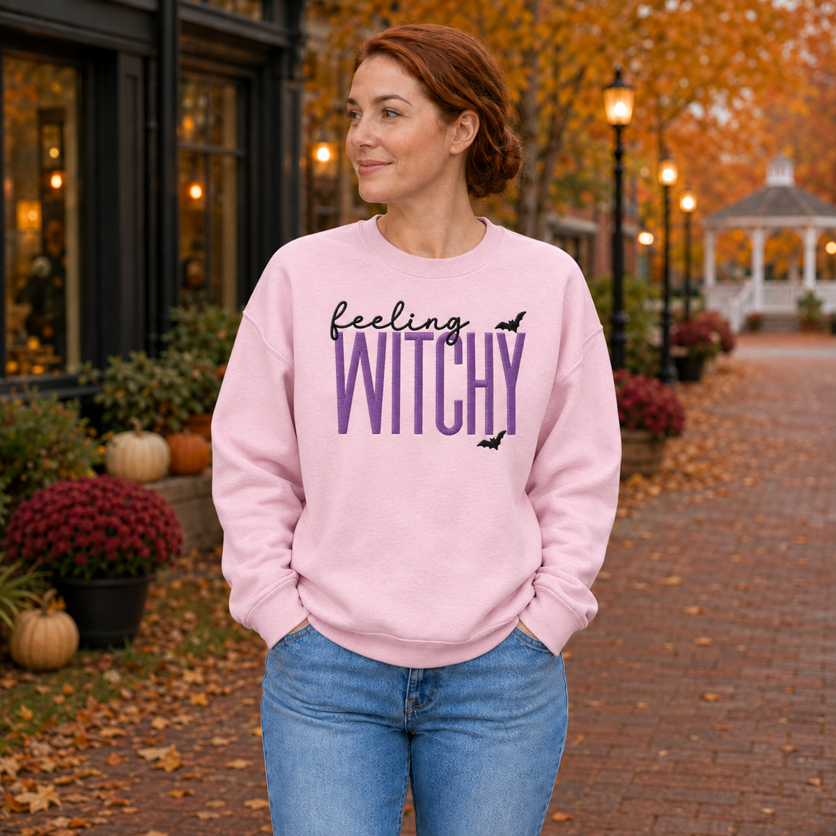 Woman wearing Light Pink witchy Halloween embroidered sweatshirt