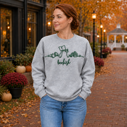 Bookish reader machine embroidery centered on a Sport Grey Gildan Softstyle sweatshirt, approximately 10 inches wide
