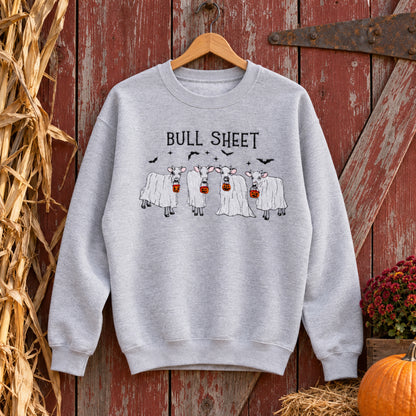 Sport Grey Bull Sheet cow ghost embroidered sweatshirt hanging naturally on a rustic barn door