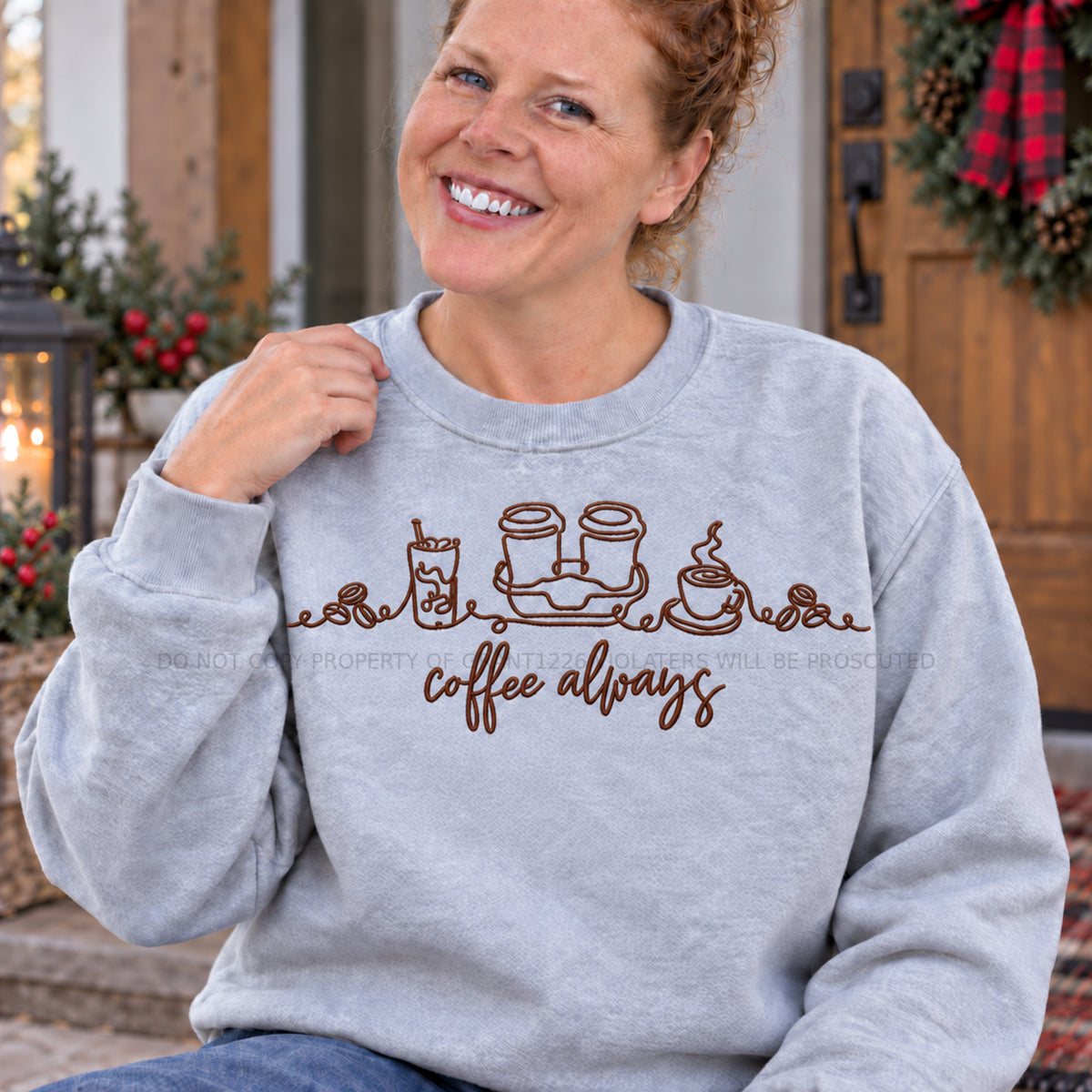 Close modeled view of espresso brown Coffee Always line art embroidery on an Ash sweatshirt
