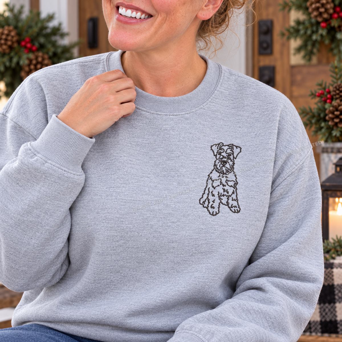 Close up of charcoal Schnauzer left chest embroidery on ash sweatshirt