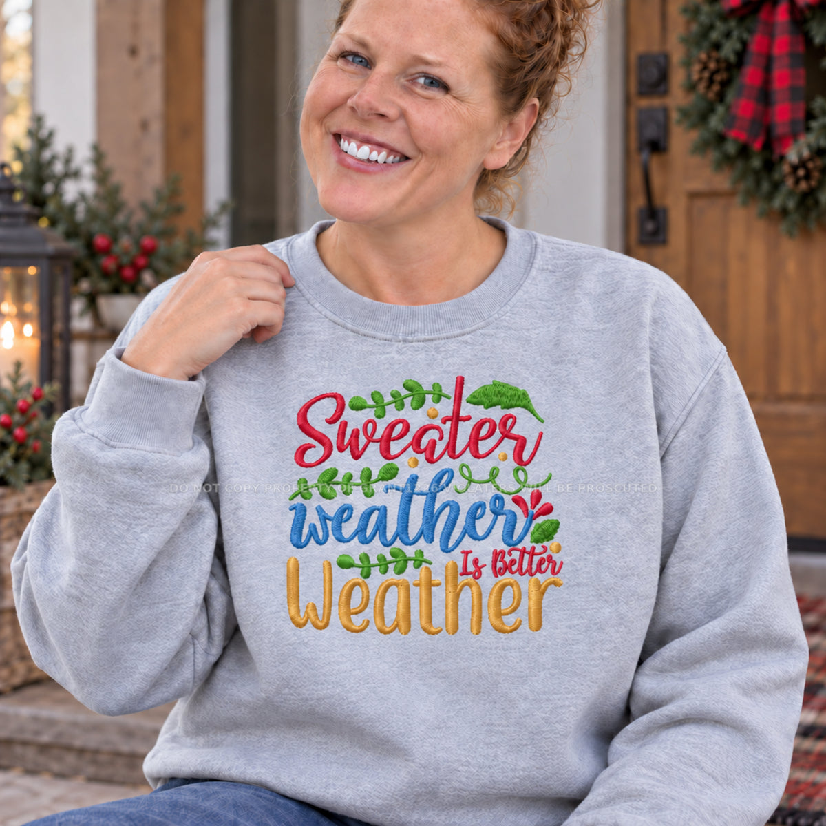 Close modeled view of colorful Sweater Weather Is Better Weather embroidery on an Ash sweatshirt