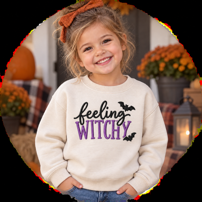 Toddler girl wearing Natural Feeling Witchy embroidered sweatshirt