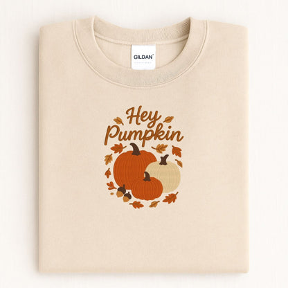 Sand Hey Pumpkin sweatshirt with three embroidered pumpkins in a cozy fall flat lay