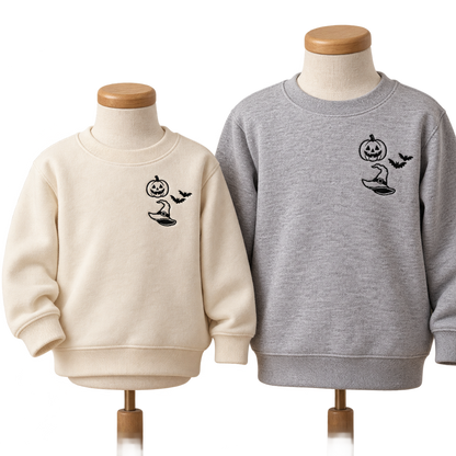 Natural toddler and Sport Grey youth sweatshirts with matching black Halloween left-chest embroidery.