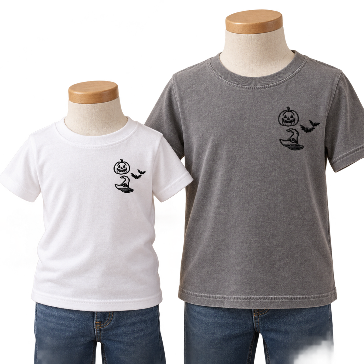 White toddler and Grey youth T-shirts with matching black Halloween left-chest embroidery.