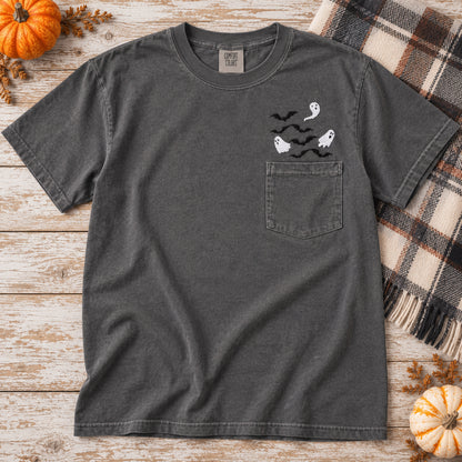 Pepper Comfort Colors pocket T-shirt with white ghost and black bat embroidery in a fall flat lay