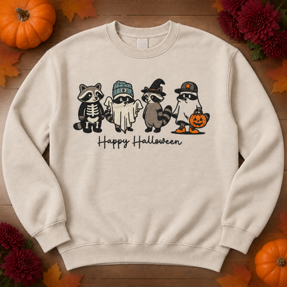 Sand crewneck sweatshirt flatlay with four costumed raccoons and Happy Halloween embroidery