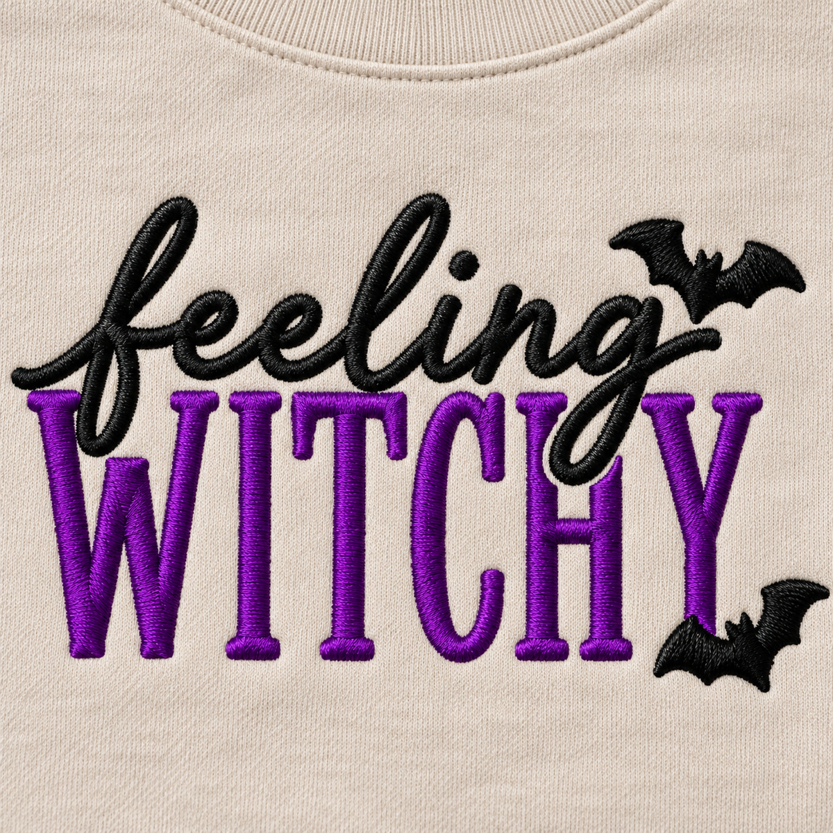 Close-up of purple and black Feeling Witchy machine embroidery