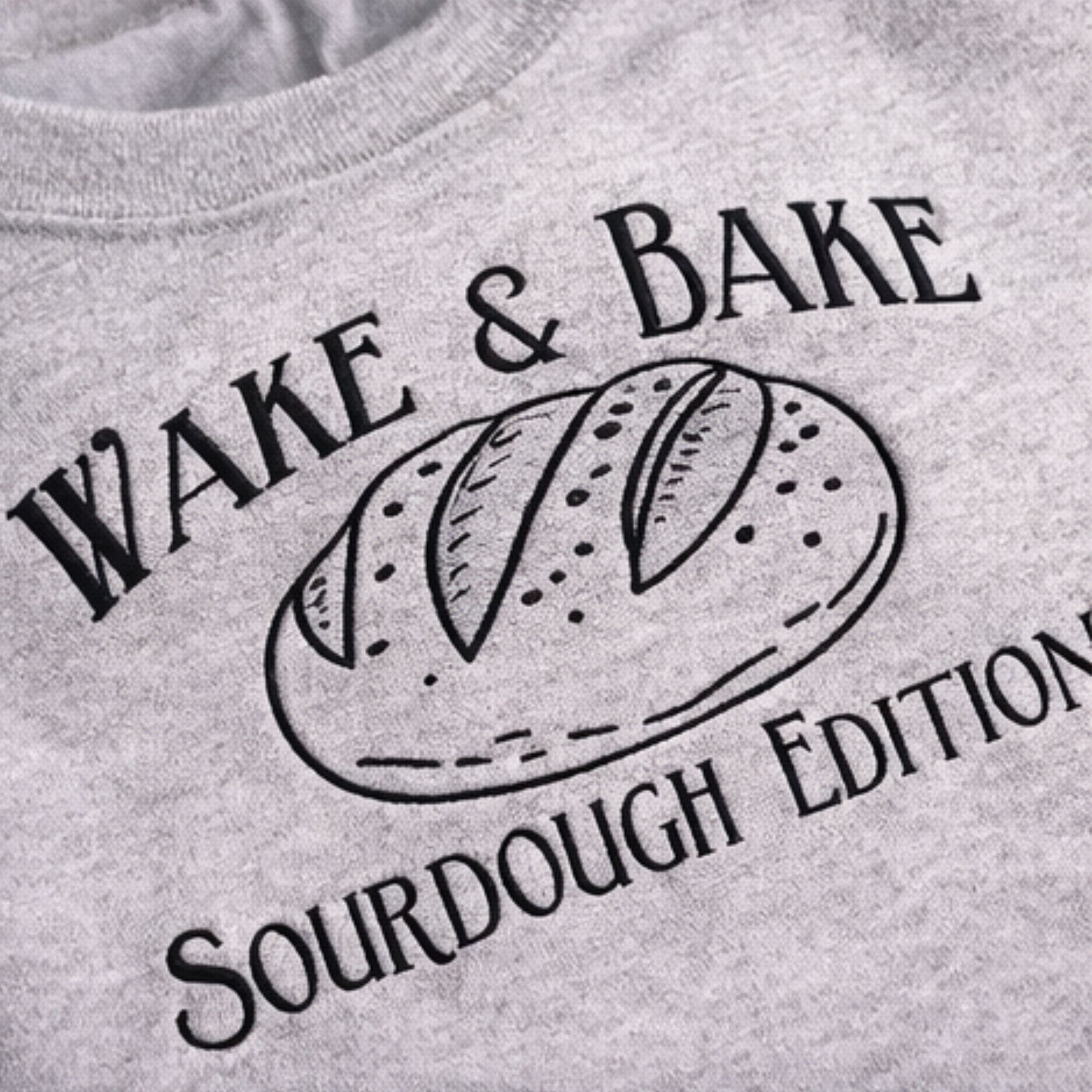 Gray sweatshirt with 'Wake & Bake Sourdough Edition' text and bread graphic.