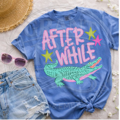 After While crocodile graphic tee styled with denim shorts and sunglasses