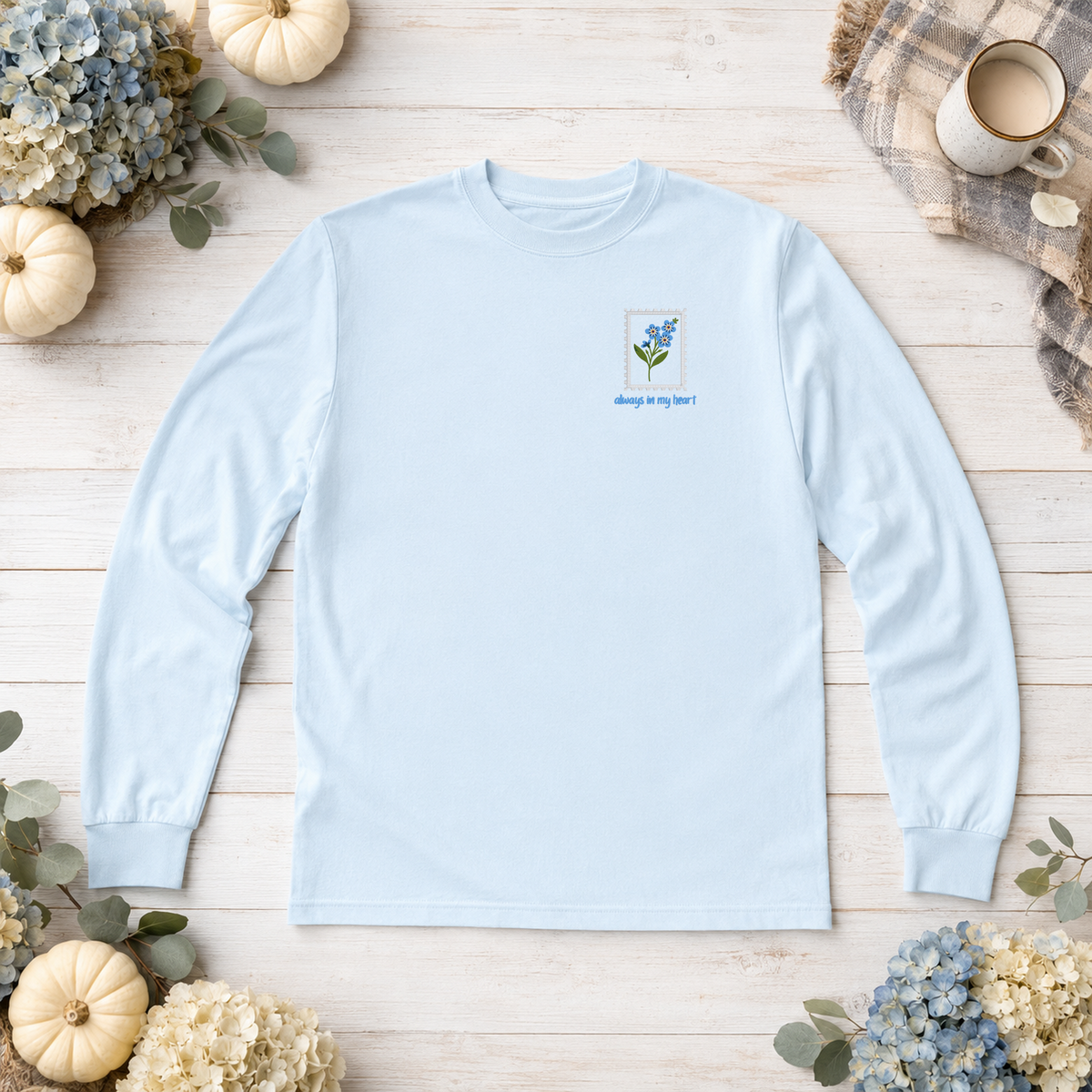 Chambray Comfort Colors 6014 long sleeve shirt flat lay with Always in My Heart forget-me-not embroidery