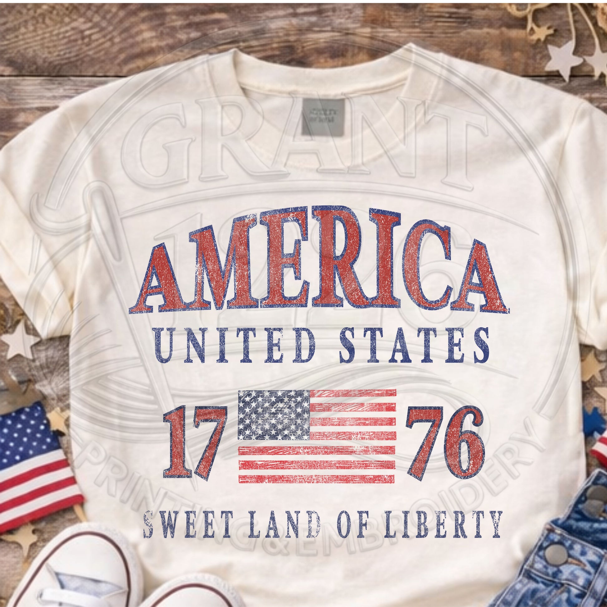 Ivory vintage America United States 1776 patriotic graphic tee flat lay with American flag decor