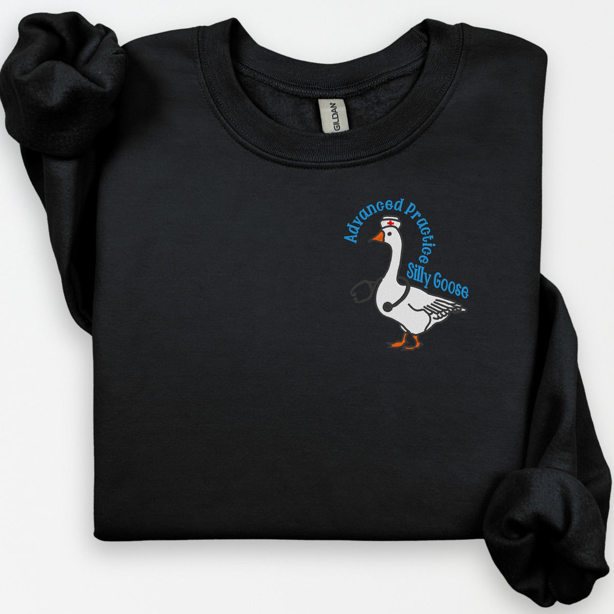 Folded black crewneck with APRN Silly Goose left-chest embroidery