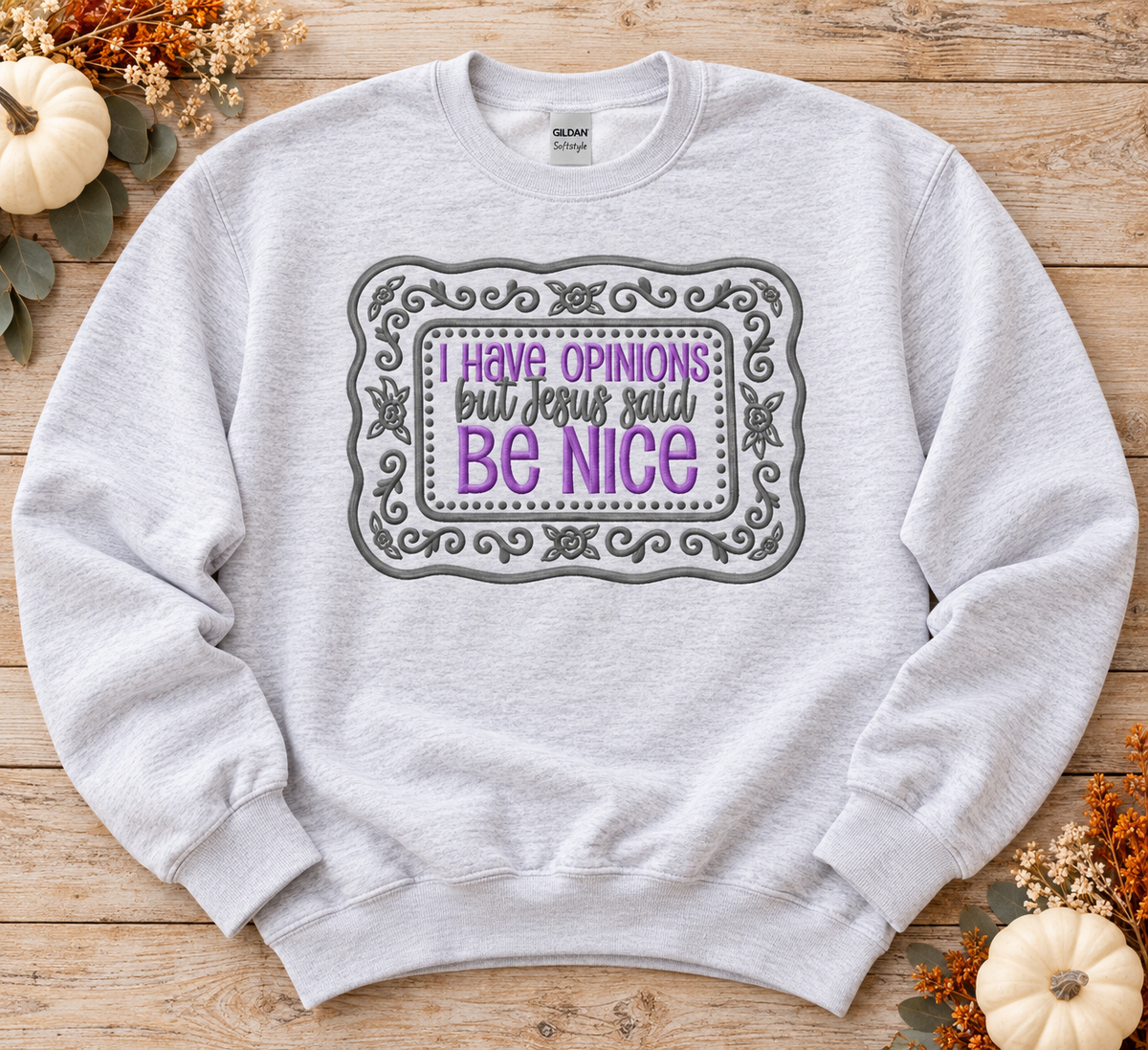 Ash Gildan Softstyle embroidered Be Nice sweatshirt flat lay with lavender and grey floral design