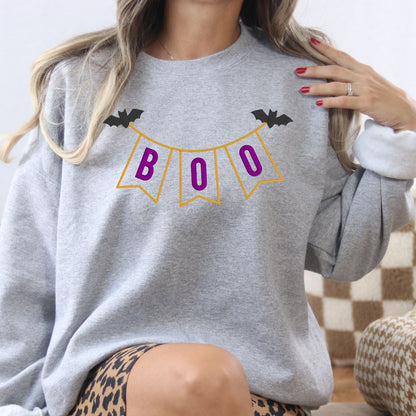 Woman wearing Ash BOO banner applique Halloween sweatshirt