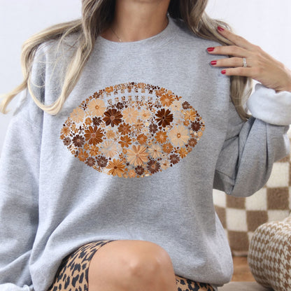 Ash floral football sweatshirt shown as a relaxed game day outfit