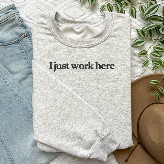 Ash Gildan crewneck embroidered with I just work here