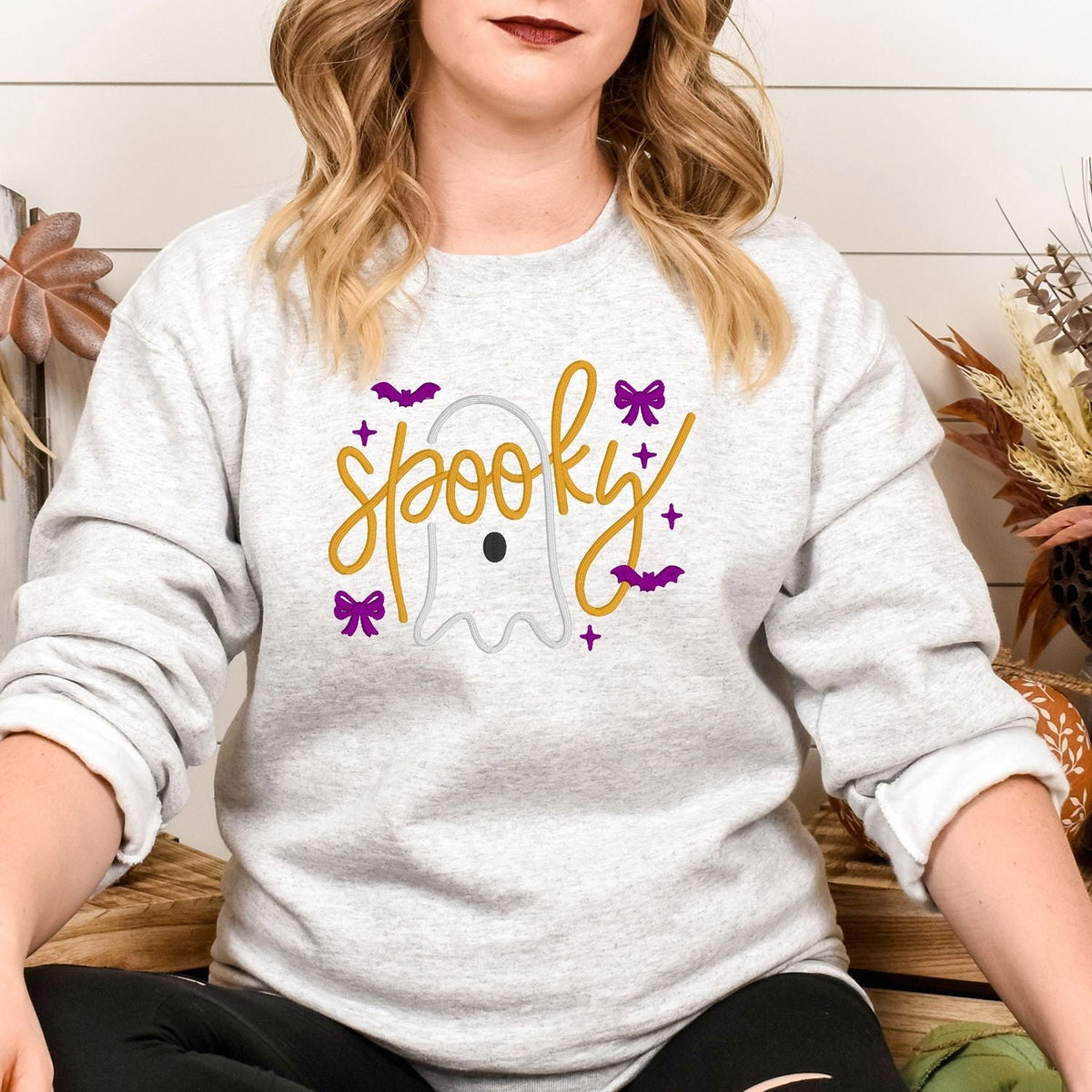 Ash embroidered ghost crewneck with orange Spooky lettering and purple bows