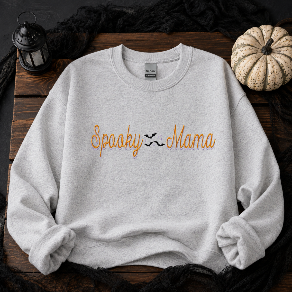 Ash Gildan Softstyle Spooky Mama embroidered Halloween sweatshirt with bats flat lay