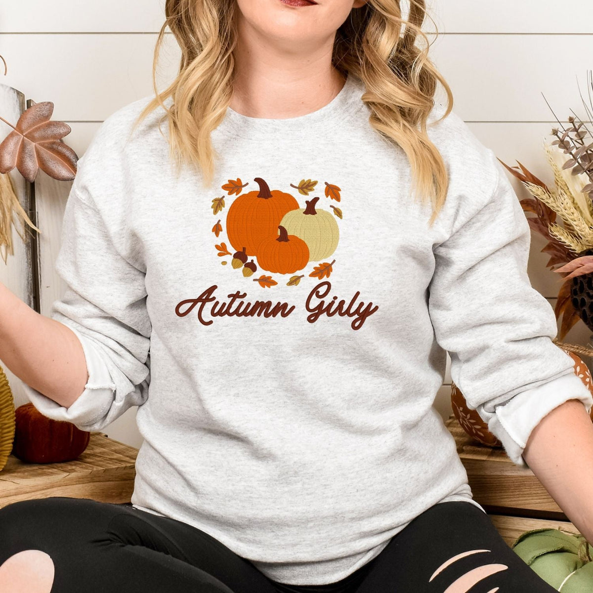 Ash Autumn Girly embroidered pumpkin sweatshirt shown in a fall setting