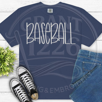 Flat lay personalized baseball shirt on navy Comfort Colors tee