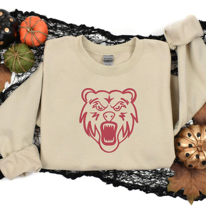 Sand bear mascot sweatshirt styled with fall pumpkins and black lace
