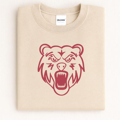 Sand bear mascot embroidered crewneck folded on a light background