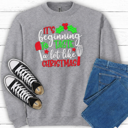 Close-up of red green and white Christmas baking embroidery on Sport Grey sweatshirt