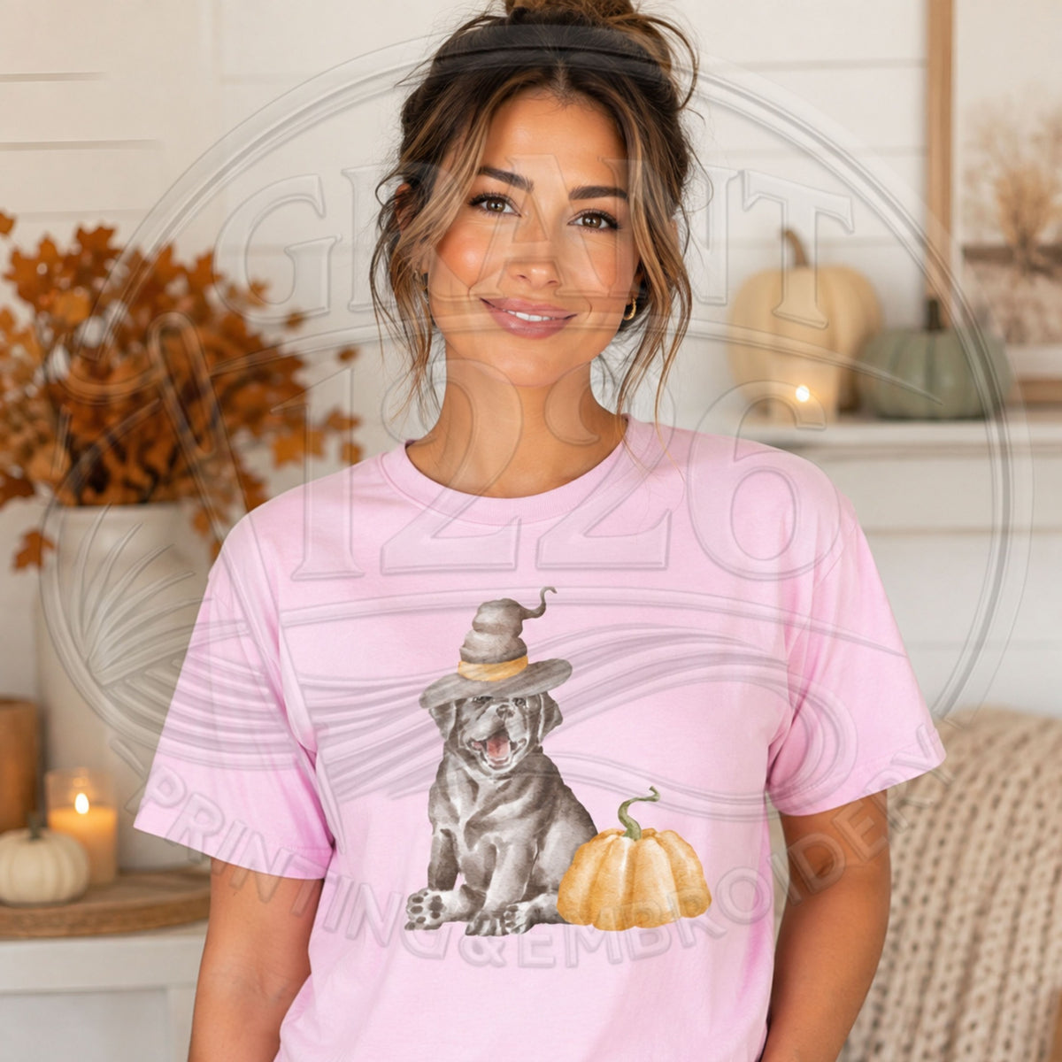 Blossom Comfort Colors short sleeve shirt with a black dog in a witch hat beside a pumpkin
