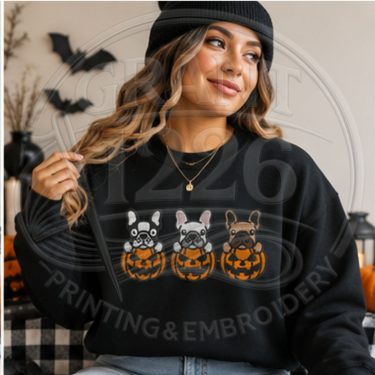 Adult wearing black embroidered French bulldog pumpkin sweatshirt