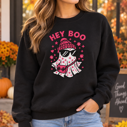 Woman wearing a black Hey Boo ghost embroidered spooky season sweatshirt