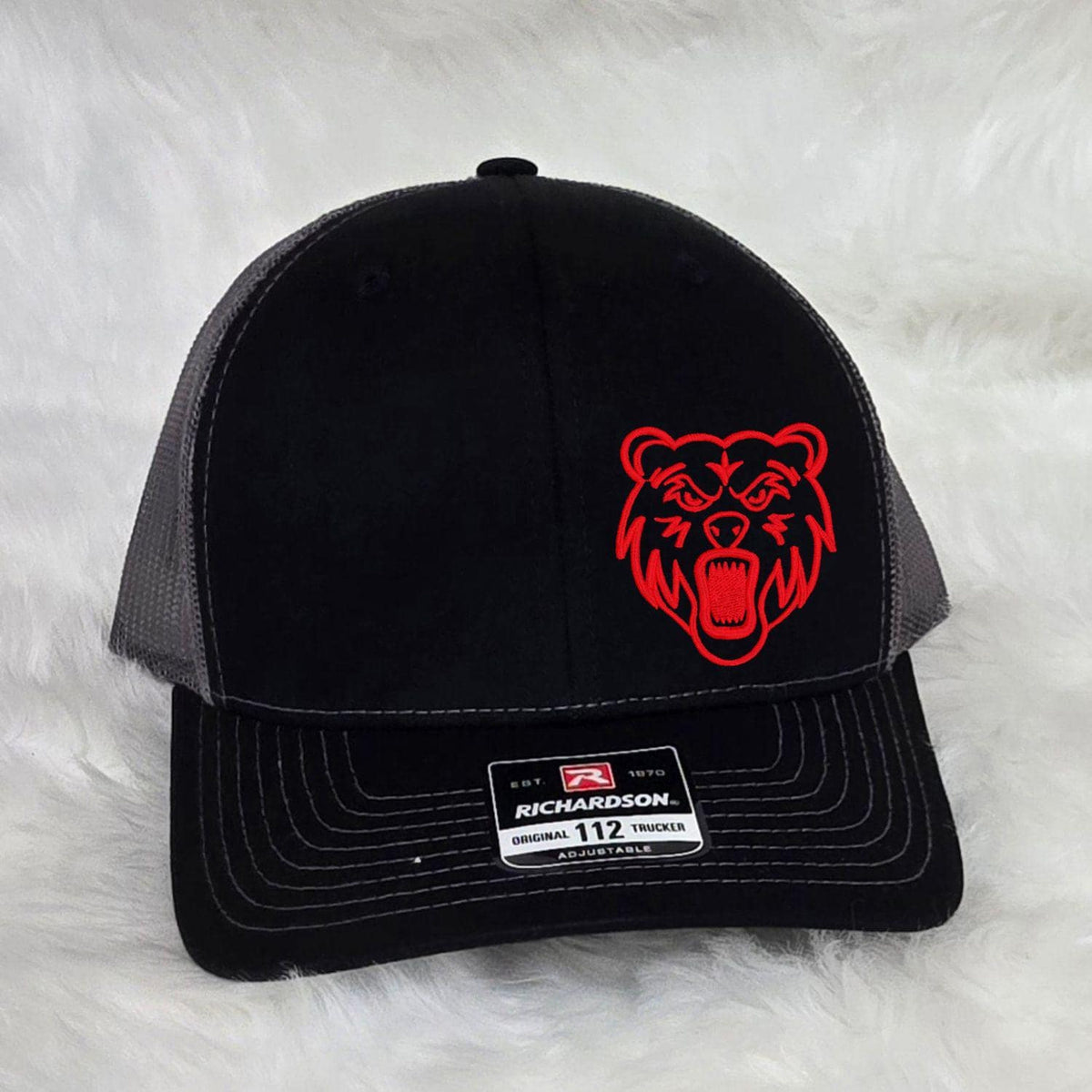 Front view of black Richardson 112 Grizzlies embroidered trucker hat
