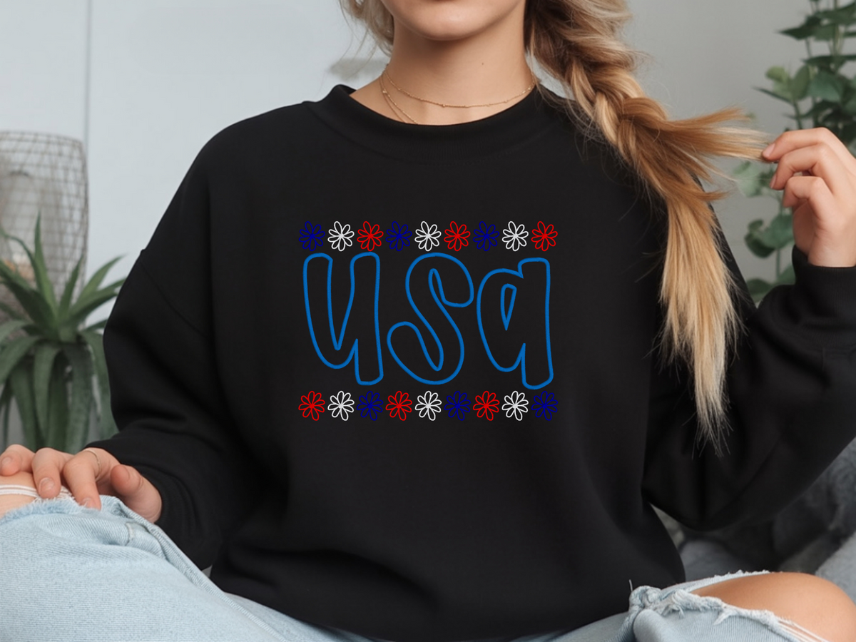Black Gildan USA embroidered crewneck with red, white, and blue daisy borders