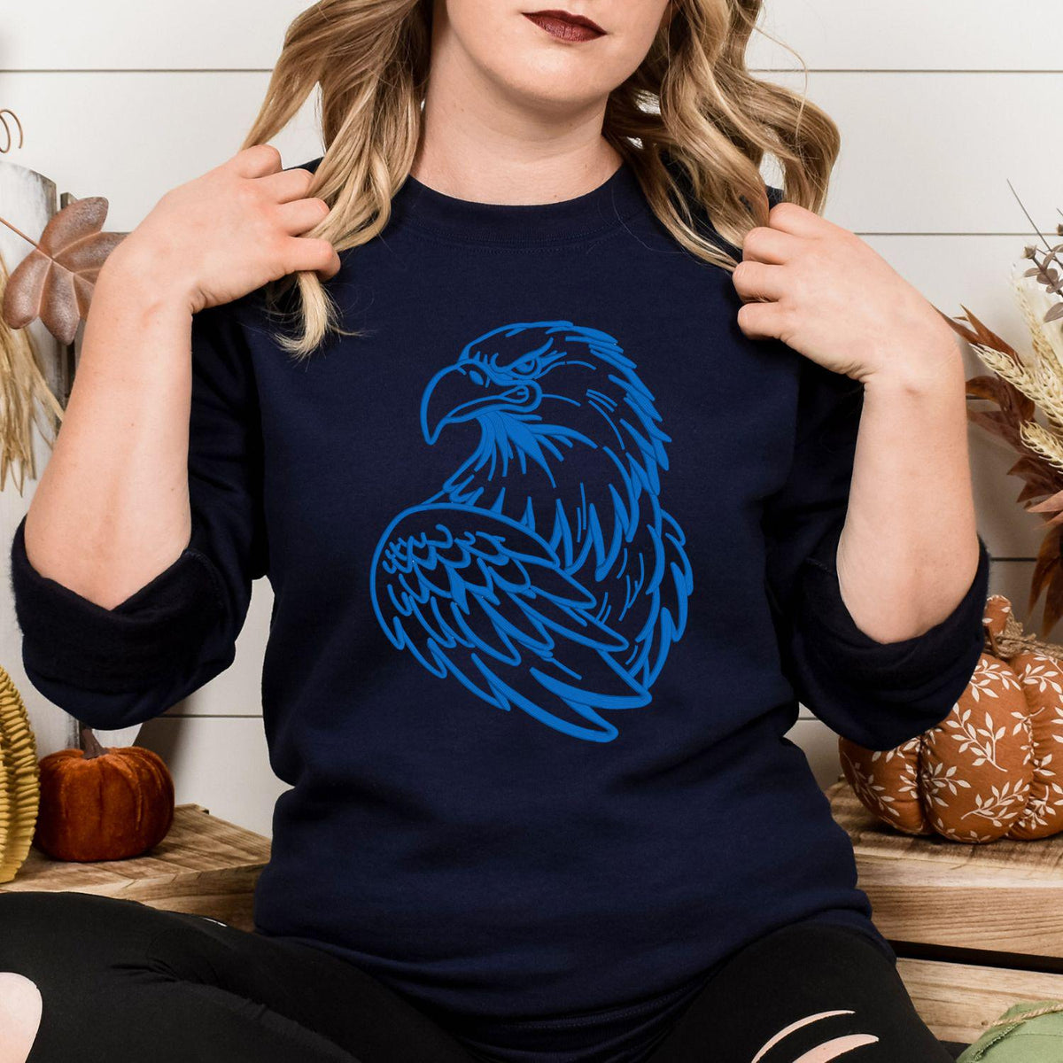 Navy sweatshirt with blue eagle mascot embroidery modeled from the front
