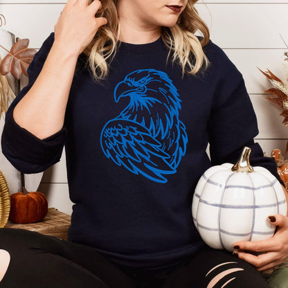 Navy eagle mascot sweatshirt modeled while holding a white pumpkin